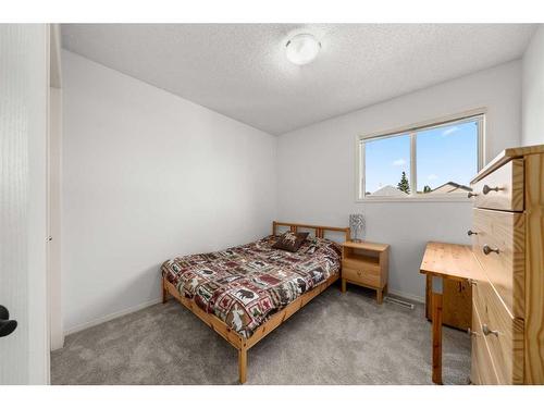 106 Bridlewood Avenue Sw, Calgary, AB - Indoor Photo Showing Bedroom