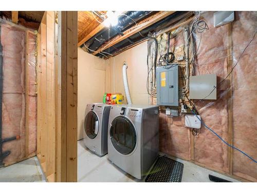 106 Bridlewood Avenue Sw, Calgary, AB - Indoor Photo Showing Laundry Room