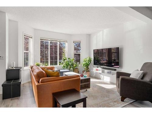 106 Bridlewood Avenue Sw, Calgary, AB - Indoor Photo Showing Living Room