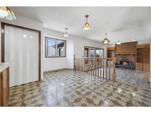 251 Maunsell Close Ne, Calgary, AB - Indoor With Fireplace