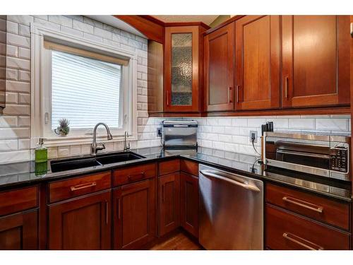 48 Hidden Spring Place Nw, Calgary, AB - Indoor Photo Showing Kitchen With Double Sink