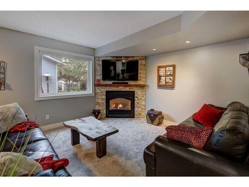 48 Hidden Spring Place Nw, Calgary, AB - Indoor Photo Showing Living Room With Fireplace