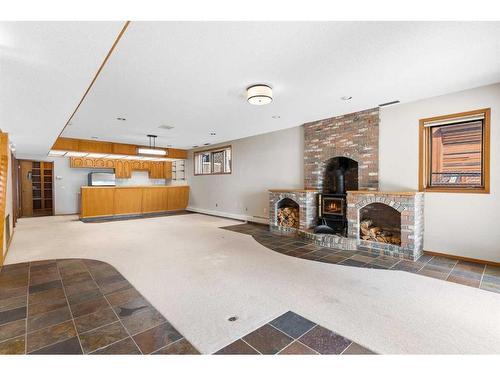 239 East Chestermere Drive, Chestermere, AB - Indoor Photo Showing Other Room With Fireplace