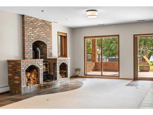 239 East Chestermere Drive, Chestermere, AB - Indoor With Fireplace