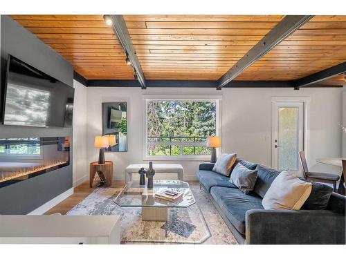 106-11010 Bonaventure Drive Se, Calgary, AB - Indoor Photo Showing Living Room With Fireplace