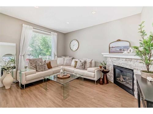 95 Elgin Drive Se, Calgary, AB - Indoor Photo Showing Living Room With Fireplace