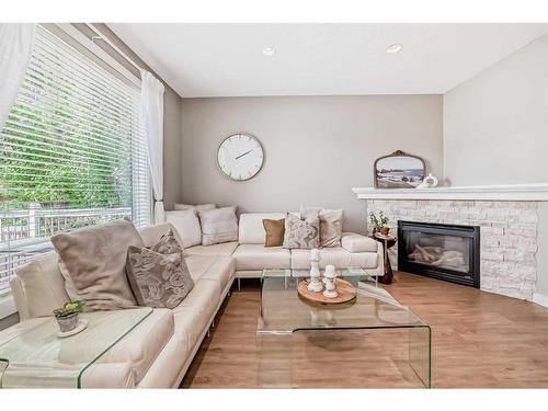 95 Elgin Drive Se, Calgary, AB - Indoor Photo Showing Living Room With Fireplace