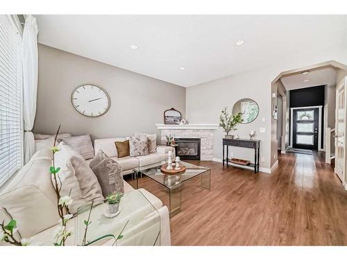 95 Elgin Drive Se, Calgary, AB - Indoor Photo Showing Living Room With Fireplace