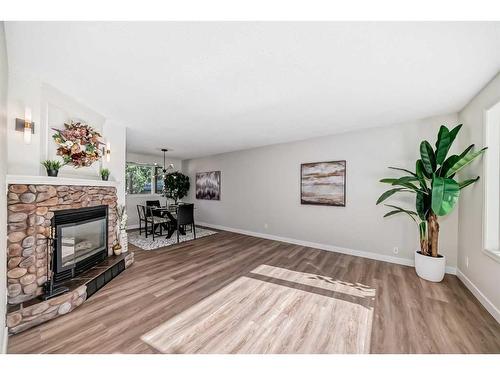 3420 Button Road Nw, Calgary, AB - Indoor Photo Showing Living Room With Fireplace