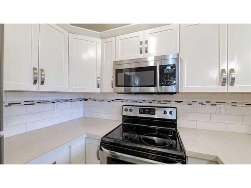 2305-130 Panatella Street Nw, Calgary, AB - Indoor Photo Showing Kitchen