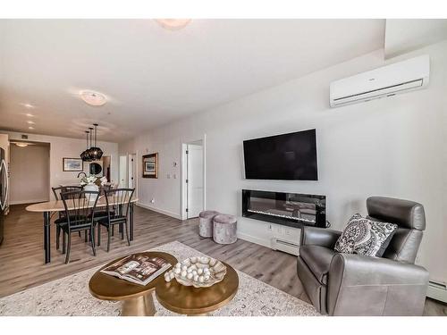 112-30 Sage Hill Walk Nw, Calgary, AB - Indoor Photo Showing Living Room With Fireplace