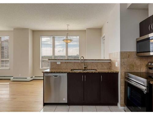 1415-1053 10 Street Sw, Calgary, AB - Indoor Photo Showing Kitchen With Stainless Steel Kitchen