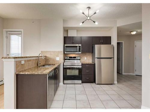 1415-1053 10 Street Sw, Calgary, AB - Indoor Photo Showing Kitchen With Stainless Steel Kitchen