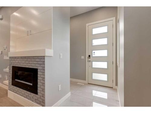 2323 1 Street Nw, Calgary, AB - Indoor With Fireplace