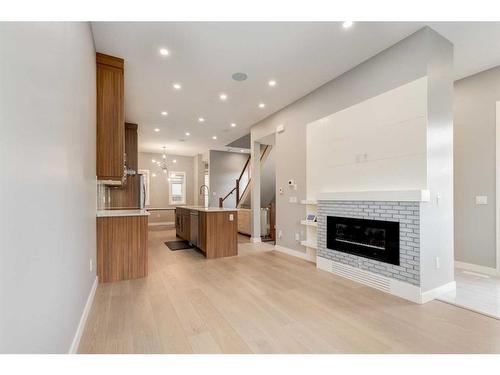 2323 1 Street Nw, Calgary, AB - Indoor Photo Showing Living Room With Fireplace