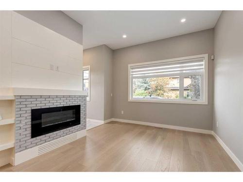 2323 1 Street Nw, Calgary, AB - Indoor Photo Showing Living Room With Fireplace