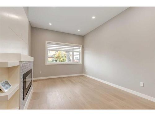 2323 1 Street Nw, Calgary, AB - Indoor Photo Showing Other Room With Fireplace