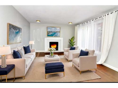 50 Discovery Ridge Road Sw, Calgary, AB - Indoor Photo Showing Living Room With Fireplace