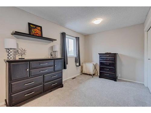 59 Rivercrest Circle Se, Calgary, AB - Indoor Photo Showing Bedroom