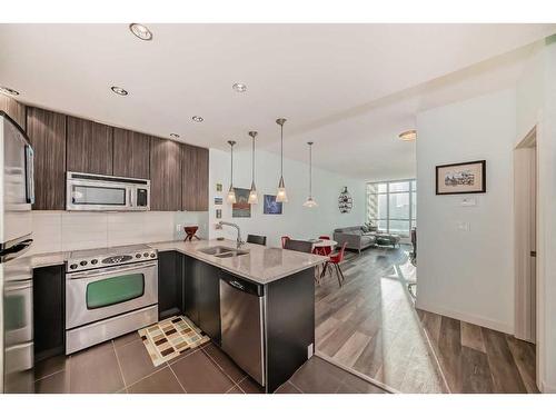 405-788 12 Avenue Sw, Calgary, AB - Indoor Photo Showing Kitchen With Stainless Steel Kitchen With Double Sink