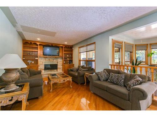 43 Signal Hill Mews Sw, Calgary, AB - Indoor Photo Showing Living Room With Fireplace