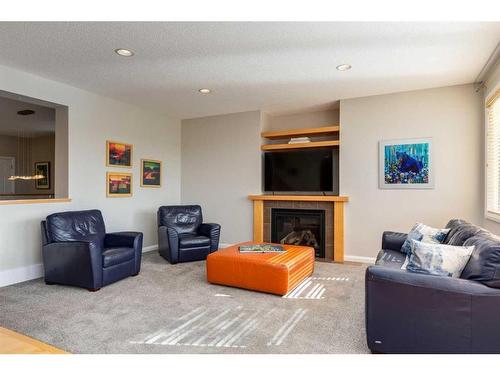 170 Panamount Road Nw, Calgary, AB - Indoor Photo Showing Living Room With Fireplace