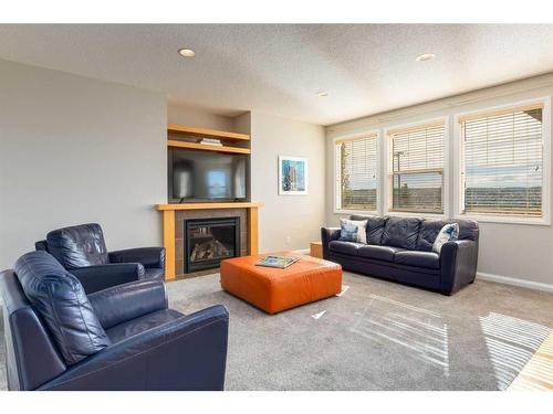 170 Panamount Road Nw, Calgary, AB - Indoor Photo Showing Living Room With Fireplace