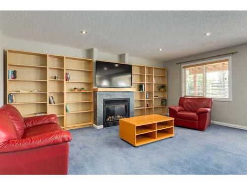 170 Panamount Road Nw, Calgary, AB - Indoor Photo Showing Living Room With Fireplace