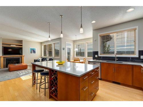 170 Panamount Road Nw, Calgary, AB - Indoor Photo Showing Kitchen With Fireplace