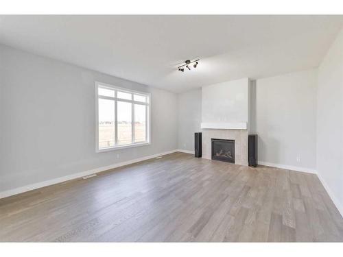 98 Waterford Road, Chestermere, AB - Indoor Photo Showing Other Room With Fireplace