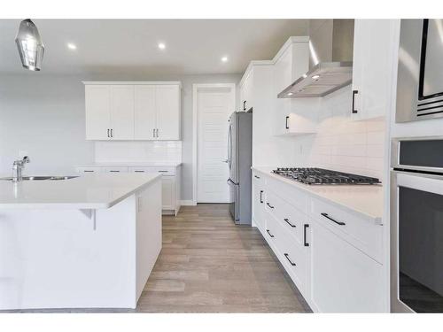 98 Waterford Road, Chestermere, AB - Indoor Photo Showing Kitchen With Upgraded Kitchen