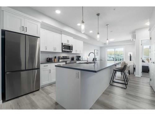 1401-42 Cranbrook Gardens Se, Calgary, AB - Indoor Photo Showing Kitchen With Upgraded Kitchen