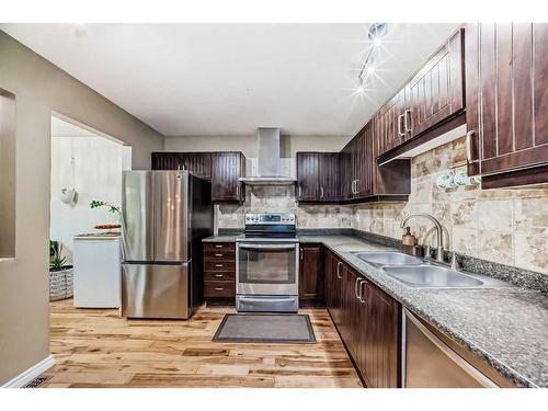 1131 Ranchlands Boulevard Nw, Calgary, AB - Indoor Photo Showing Kitchen With Stainless Steel Kitchen With Double Sink