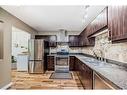 1131 Ranchlands Boulevard Nw, Calgary, AB  - Indoor Photo Showing Kitchen With Stainless Steel Kitchen With Double Sink 