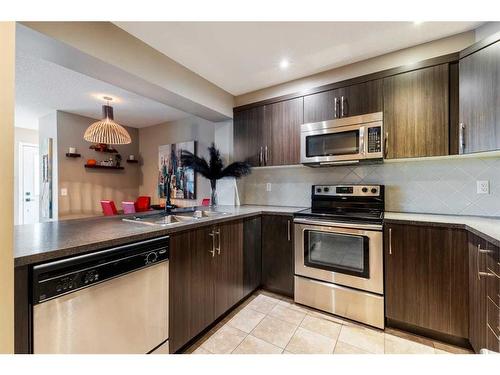 3007 Windsong Boulevard Sw, Airdrie, AB - Indoor Photo Showing Kitchen With Stainless Steel Kitchen With Double Sink