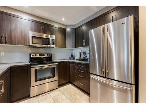 3007 Windsong Boulevard Sw, Airdrie, AB - Indoor Photo Showing Kitchen With Stainless Steel Kitchen