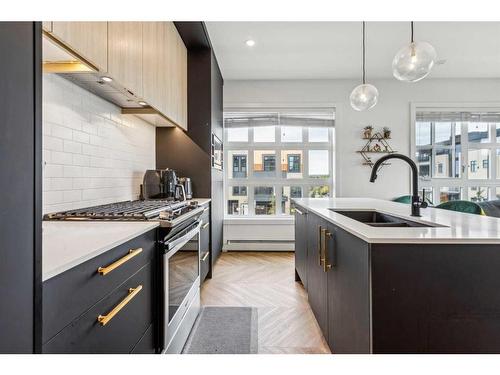 212-4275 Norford Avenue Nw, Calgary, AB - Indoor Photo Showing Kitchen With Double Sink With Upgraded Kitchen