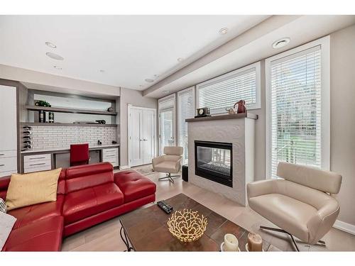 2007 1 Avenue Nw, Calgary, AB - Indoor Photo Showing Living Room With Fireplace