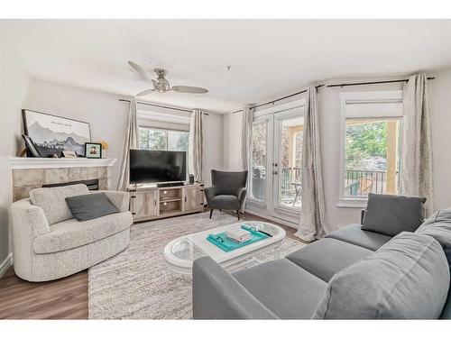 205-735 56 Avenue Sw, Calgary, AB - Indoor Photo Showing Living Room