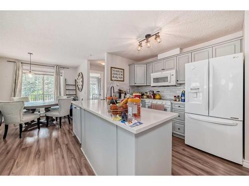 205-735 56 Avenue Sw, Calgary, AB - Indoor Photo Showing Kitchen With Upgraded Kitchen