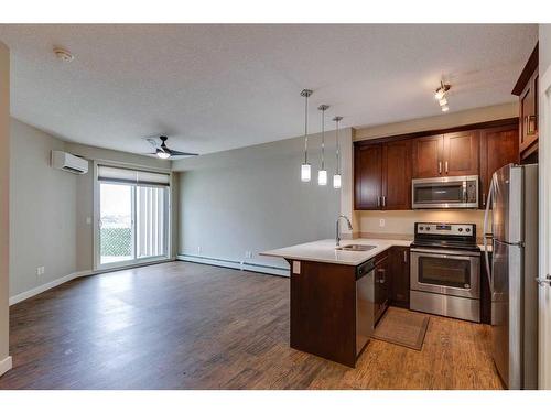 401-110 Auburn Meadows View Se, Calgary, AB - Indoor Photo Showing Kitchen With Stainless Steel Kitchen With Double Sink