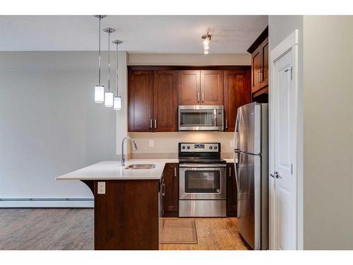 401-110 Auburn Meadows View Se, Calgary, AB - Indoor Photo Showing Kitchen With Stainless Steel Kitchen With Upgraded Kitchen