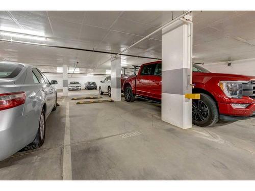 311-138 Waterfront Court Sw, Calgary, AB - Indoor Photo Showing Garage