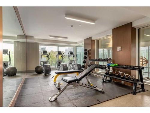 311-138 Waterfront Court Sw, Calgary, AB - Indoor Photo Showing Gym Room