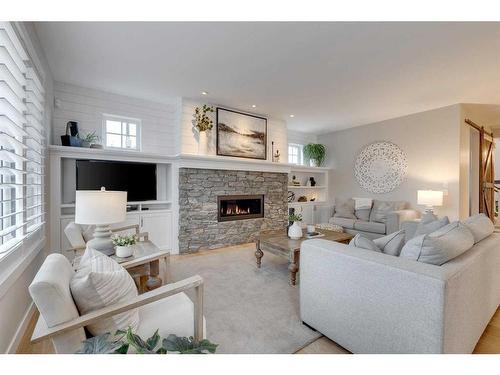 163 Auburn Sound Manor Se, Calgary, AB - Indoor Photo Showing Living Room With Fireplace