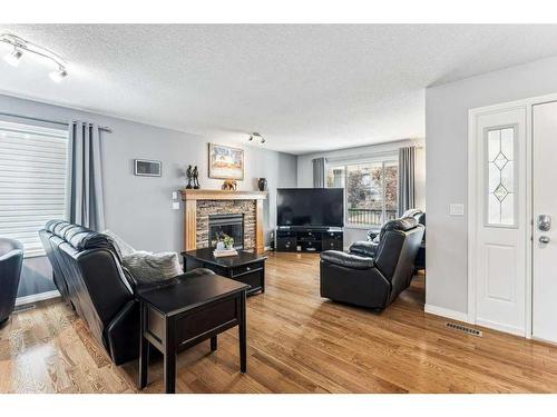 195 West Creek Landing, Chestermere, AB - Indoor Photo Showing Living Room With Fireplace