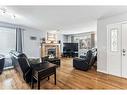 195 West Creek Landing, Chestermere, AB  - Indoor Photo Showing Living Room With Fireplace 