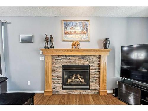 195 West Creek Landing, Chestermere, AB - Indoor Photo Showing Living Room With Fireplace