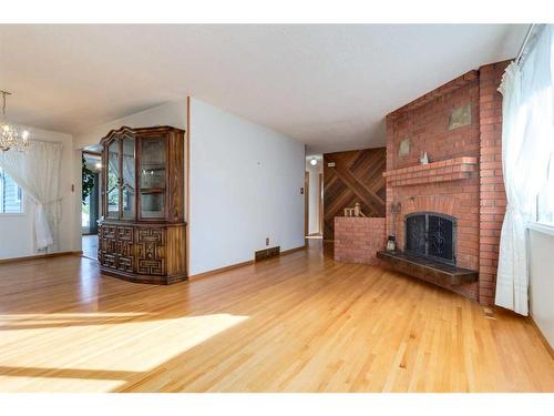 56 Huntwick Way Ne, Calgary, AB - Indoor Photo Showing Living Room With Fireplace