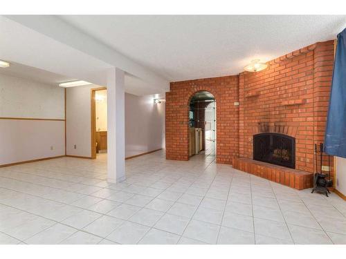 56 Huntwick Way Ne, Calgary, AB - Indoor With Fireplace